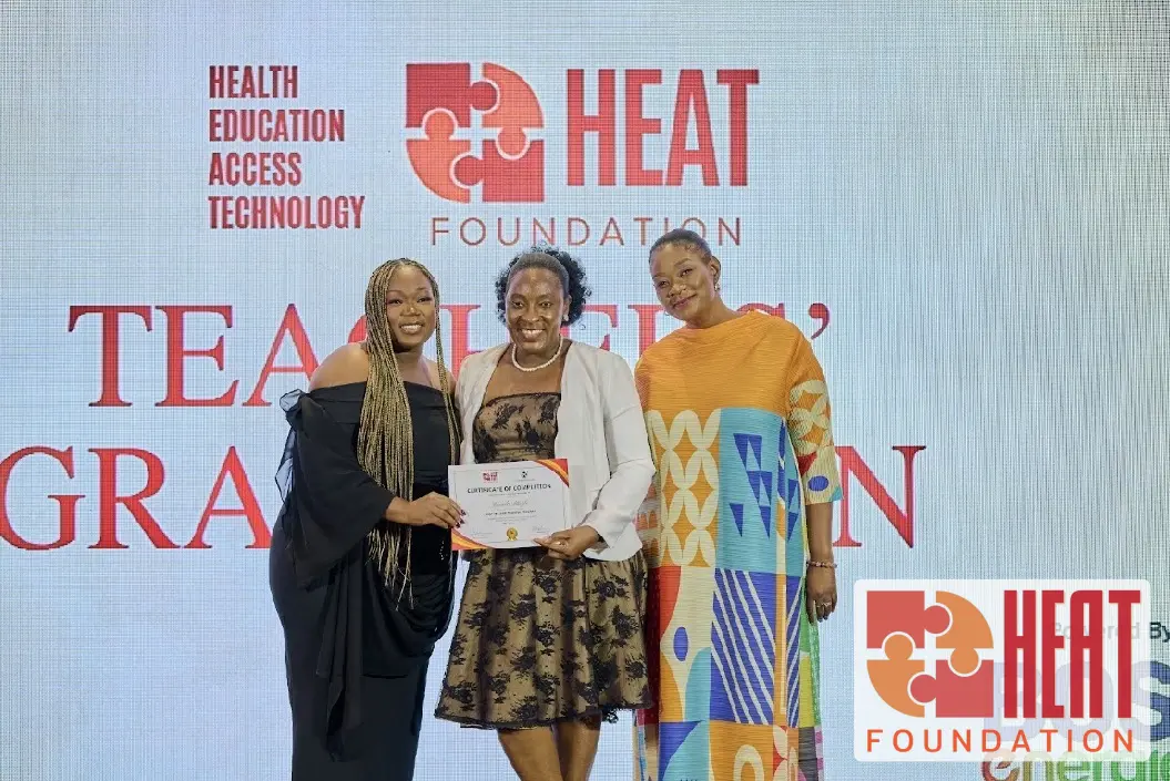 A certificate presentation at the HEAT Teacher Training Program graduation